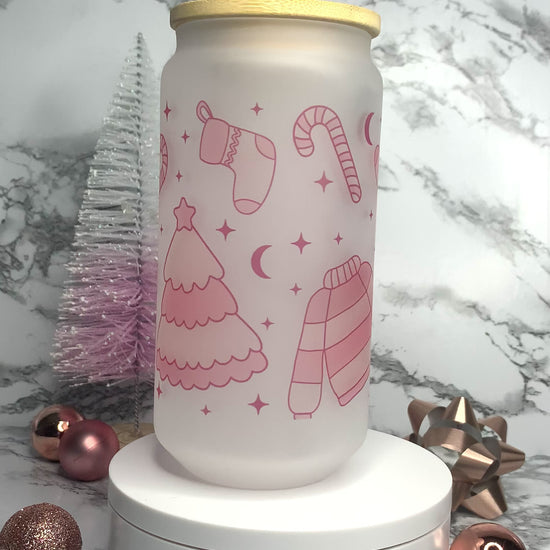 Frosted Libbey Glass Cup, with light pink christmas trees, sweater, candy canes and stockings.