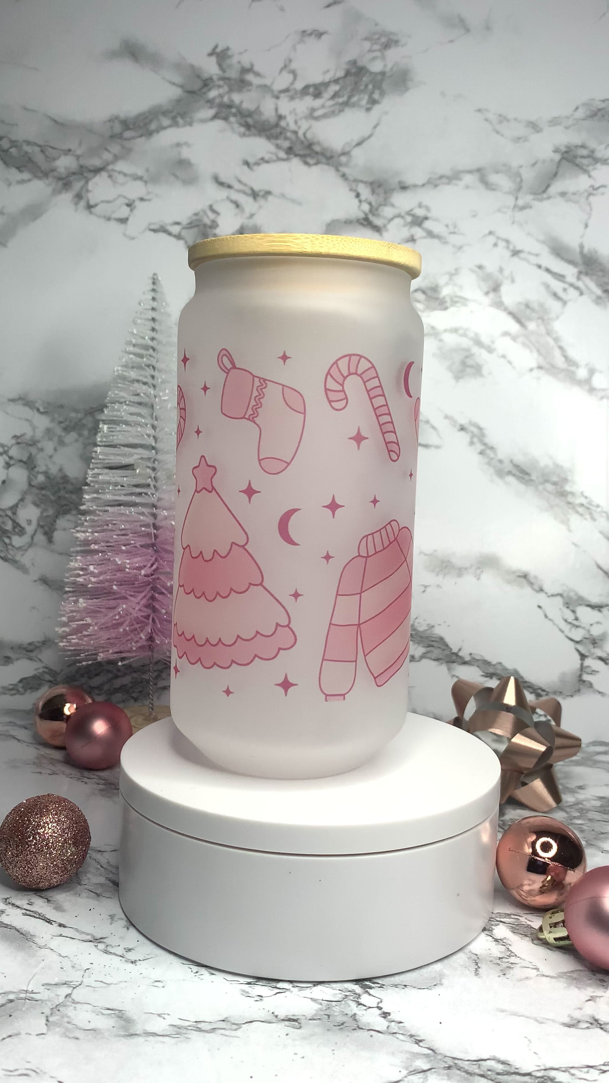 Frosted Libbey Glass Cup, with light pink christmas trees, sweater, candy canes and stockings.